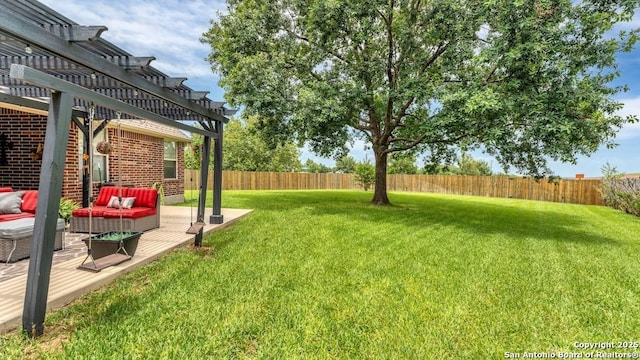 view of yard with an outdoor hangout area, a fenced backyard, a wooden deck, and a pergola