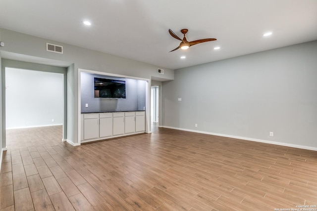 unfurnished living room featuring visible vents, light wood-style flooring, recessed lighting, and a ceiling fan