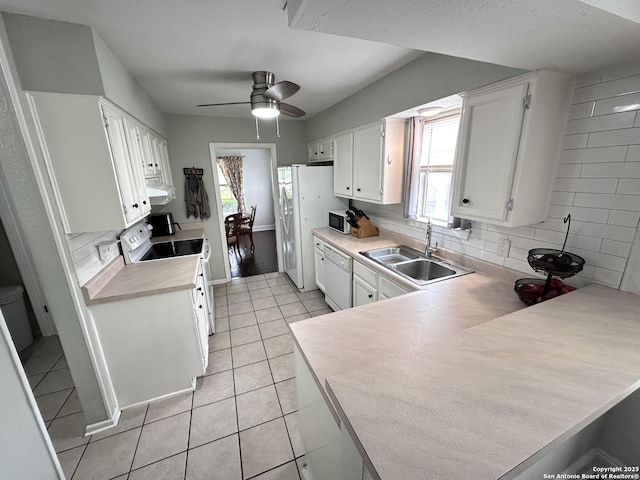 3401 Sugarhill, San Antonio, TX 78230 - kitchen with white cabinetry, white appliances, light tile patterned floors, backsplash, and a sink