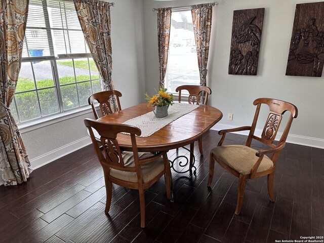 3401 Sugarhill, San Antonio, TX 78230 - dining room featuring baseboards, wood tiled floor, and plenty of natural light