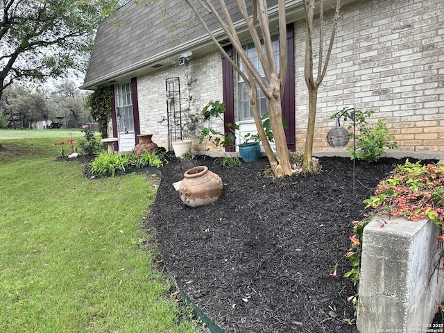 3401 Sugarhill, San Antonio, TX 78230 - view of side of home with brick siding, a shingled roof, mansard roof, and a yard