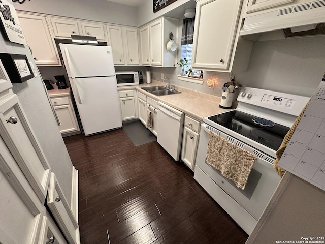 3401 Sugarhill, San Antonio, TX 78230 - kitchen with light countertops, a sink, under cabinet range hood, white appliances, and dark wood-style flooring