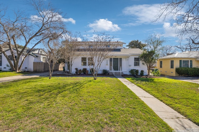 2334 W Huisache, San Antonio, TX 78201 - ranch-style home with a front lawn, stucco siding, and fence