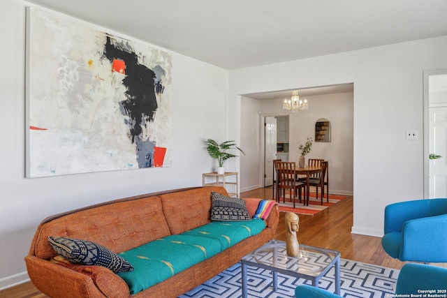 2334 W Huisache, San Antonio, TX 78201 - living room with baseboards, wood finished floors, and a chandelier