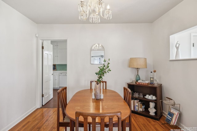 2334 W Huisache, San Antonio, TX 78201 - dining space with baseboards, wood finished floors, and an inviting chandelier