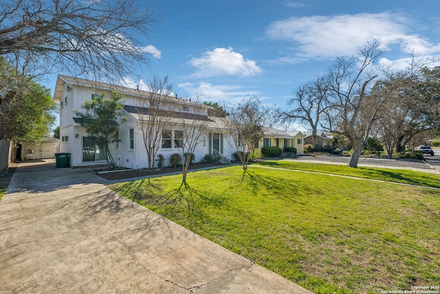 2334 W Huisache, San Antonio, TX 78201 - view of front of home with a front yard, driveway, and stucco siding