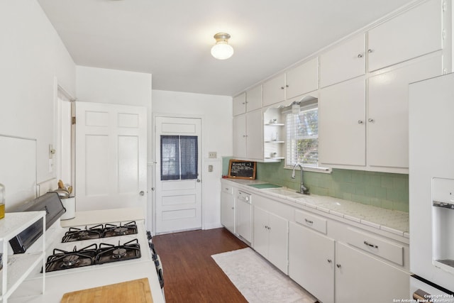2334 W Huisache, San Antonio, TX 78201 - kitchen with white appliances, light countertops, tasteful backsplash, and white cabinets