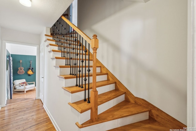 2334 W Huisache, San Antonio, TX 78201 - stairs with baseboards and wood finished floors