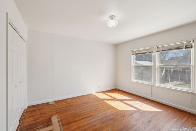 2334 W Huisache, San Antonio, TX 78201 - spare room with hardwood / wood-style floors and baseboards