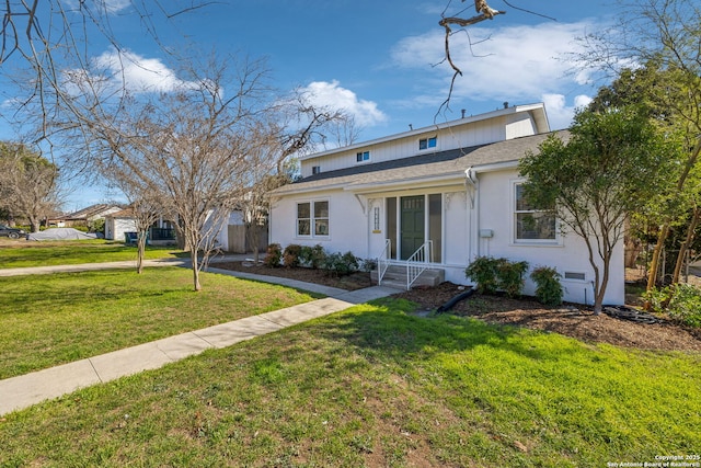 2334 W Huisache, San Antonio, TX 78201 - view of front facade with a front yard, stucco siding, and roof with shingles