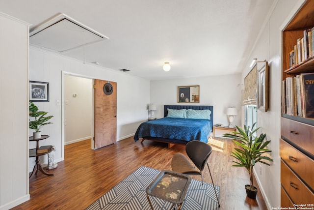 2334 W Huisache, San Antonio, TX 78201 - bedroom with attic access, baseboards, and wood finished floors