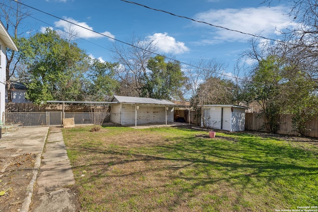 2334 W Huisache, San Antonio, TX 78201 - view of yard featuring a fenced backyard, a storage unit, and an outbuilding