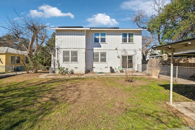 2334 W Huisache, San Antonio, TX 78201 - back of house featuring a lawn, fence, and central air condition unit