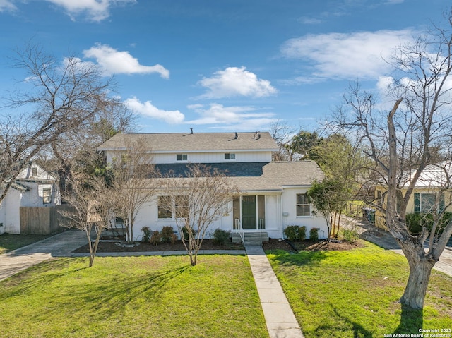 2334 W Huisache, San Antonio, TX 78201 - traditional home featuring driveway, a front yard, roof with shingles, stucco siding, and fence