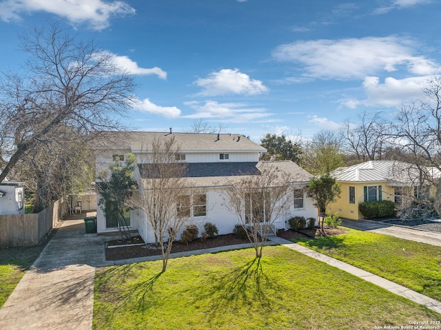 2334 W Huisache, San Antonio, TX 78201 - view of front of house with concrete driveway, stucco siding, fence, and a front lawn
