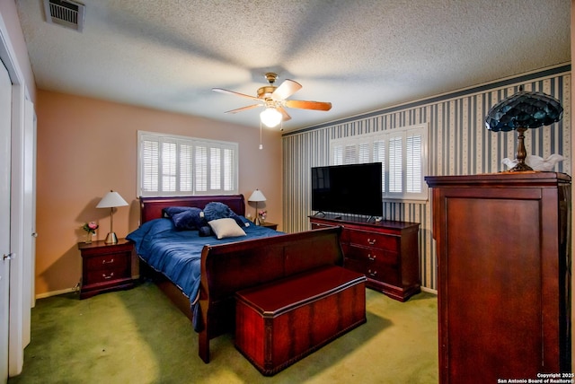 3422 William Penn Dr, San Antonio, TX 78230 - bedroom with carpet floors, a textured ceiling, multiple windows, and visible vents
