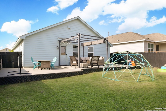 back of property with an outdoor living space, fence, a pergola, and a patio area