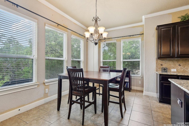 dining area with a wealth of natural light, a chandelier, and ornamental molding