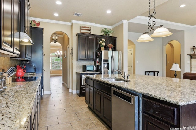 kitchen with arched walkways, a sink, appliances with stainless steel finishes, and visible vents