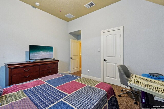 bedroom featuring baseboards, visible vents, and carpet flooring
