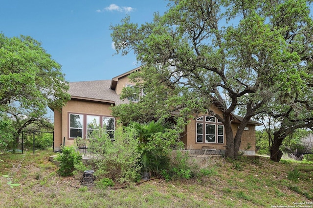 view of front of house featuring stucco siding