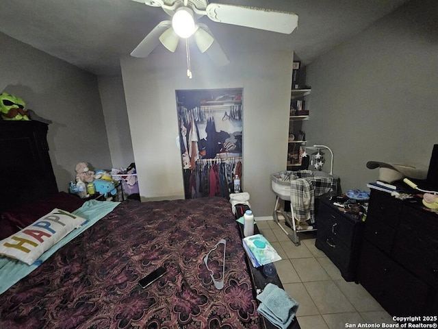 bedroom with light tile patterned floors and ceiling fan