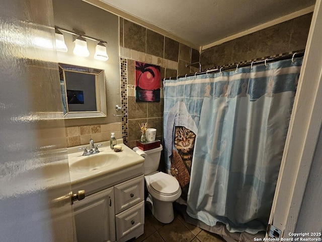 full bathroom featuring toilet, vanity, tasteful backsplash, tile patterned flooring, and tile walls