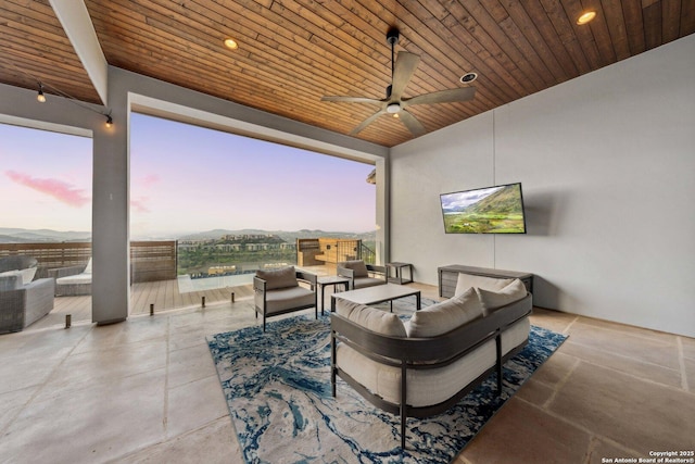 6743 Bella Colina, San Antonio, TX 78256 - patio terrace at dusk with an outdoor living space and ceiling fan