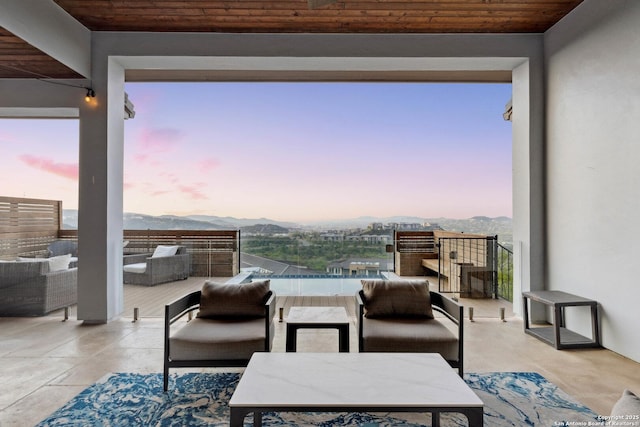 6743 Bella Colina, San Antonio, TX 78256 - view of patio with a balcony, a mountain view, an outdoor living space, and outdoor dining space