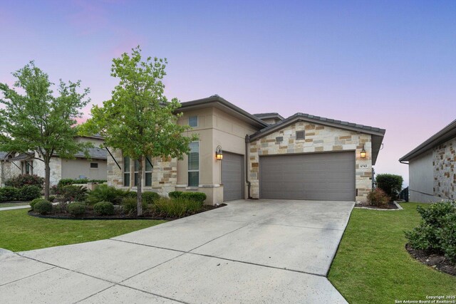 6743 Bella Colina, San Antonio, TX 78256 - view of front facade with stone siding, an attached garage, a yard, and driveway