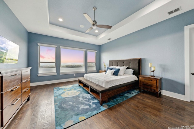 6743 Bella Colina, San Antonio, TX 78256 - bedroom featuring baseboards, dark wood-style floors, visible vents, and a raised ceiling