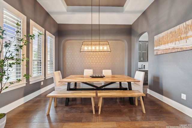 6743 Bella Colina, San Antonio, TX 78256 - dining space with baseboards, a raised ceiling, arched walkways, dark wood finished floors, and a notable chandelier