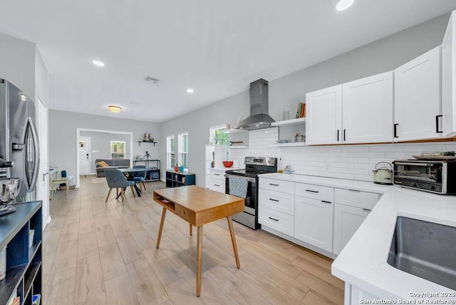 kitchen with stainless steel range with electric stovetop, a toaster, wall chimney exhaust hood, open shelves, and backsplash