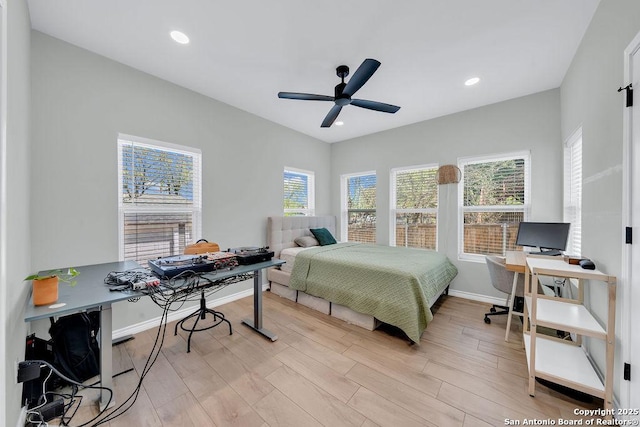 bedroom with a ceiling fan, baseboards, light wood finished floors, and recessed lighting