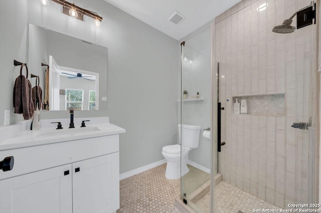 full bathroom with toilet, baseboards, visible vents, a ceiling fan, and tiled shower