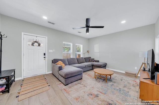 living area with recessed lighting, baseboards, ceiling fan, and visible vents