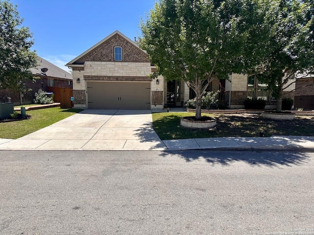 2015 Sladen, San Antonio, TX 78253 - view of front of property with concrete driveway, a garage, stone siding, and brick siding