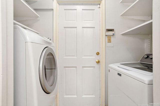laundry area with laundry area and washer and dryer