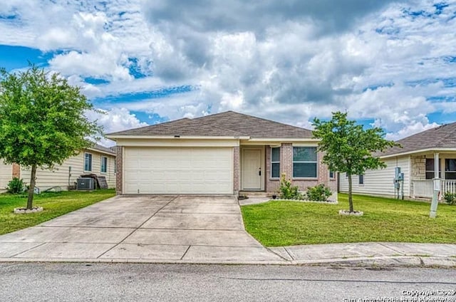 San Antonio, TX 78245 - ranch-style house with concrete driveway, an attached garage, central AC unit, a front lawn, and brick siding