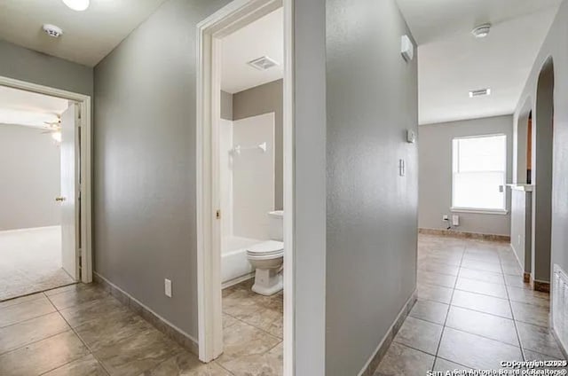San Antonio, TX 78245 - hall featuring baseboards, visible vents, arched walkways, and tile patterned flooring
