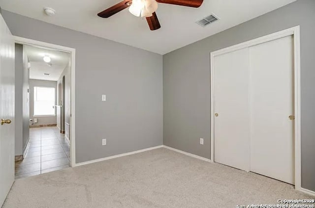 San Antonio, TX 78245 - unfurnished bedroom with carpet flooring, baseboards, a closet, and visible vents