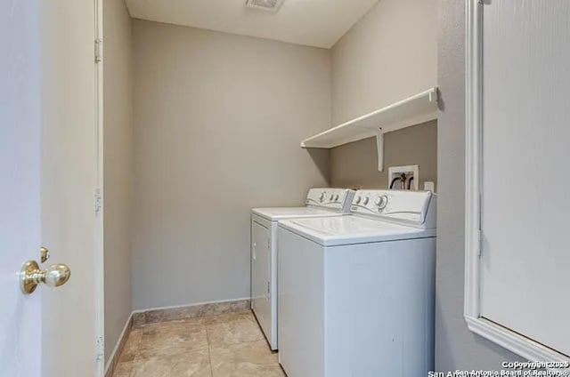 San Antonio, TX 78245 - laundry room with baseboards, separate washer and dryer, laundry area, and light tile patterned floors