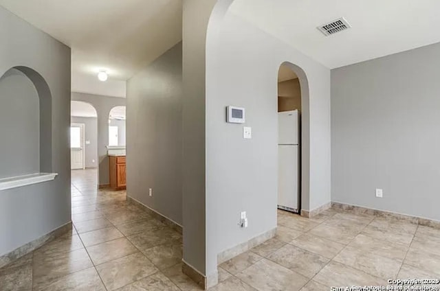 San Antonio, TX 78245 - corridor featuring arched walkways, baseboards, and visible vents