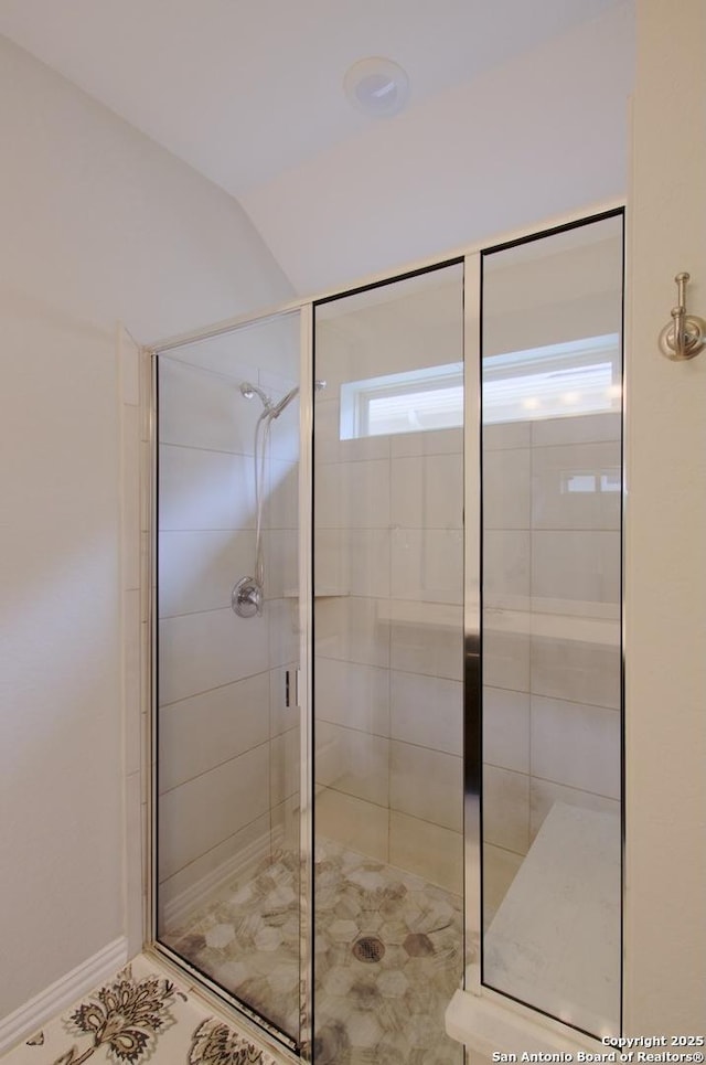 full bath featuring a shower stall