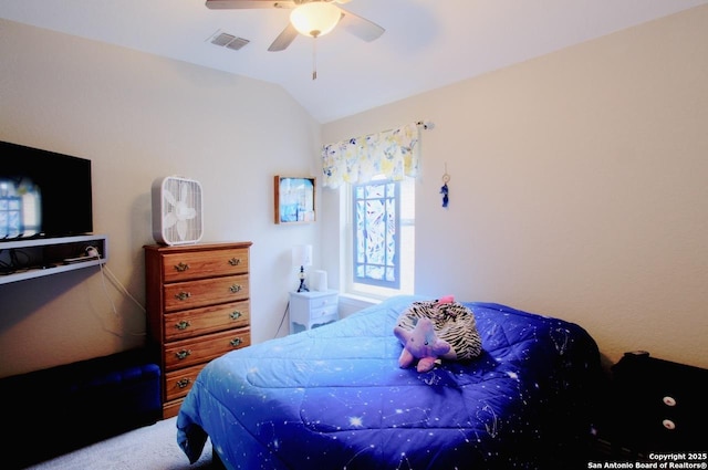 bedroom featuring a ceiling fan, vaulted ceiling, and visible vents