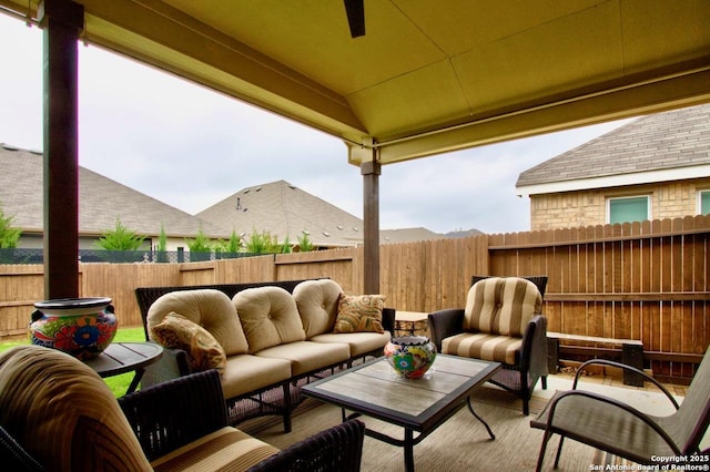 view of patio / terrace with an outdoor living space and fence