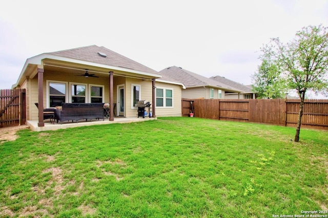 back of property featuring a fenced backyard, a ceiling fan, a patio, and a lawn