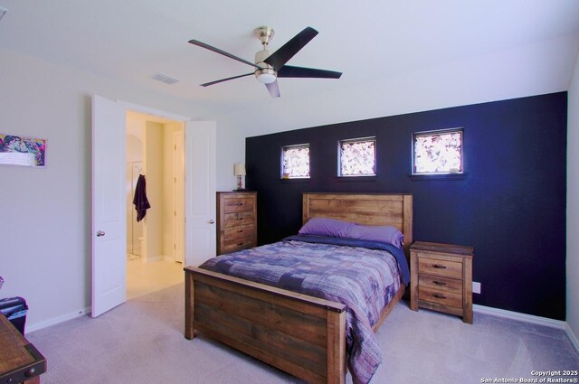 bedroom featuring baseboards, visible vents, ceiling fan, and carpet floors