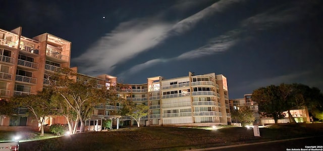 1000-1D Guadalupe St Unit 1D, Kerrville, TX 78028 - property at twilight with a view of apartment building / complex
