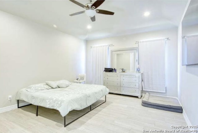 bedroom featuring ceiling fan, baseboards, wood finished floors, and recessed lighting